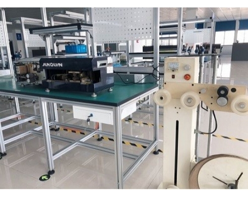 Ribbon cable stripping machine